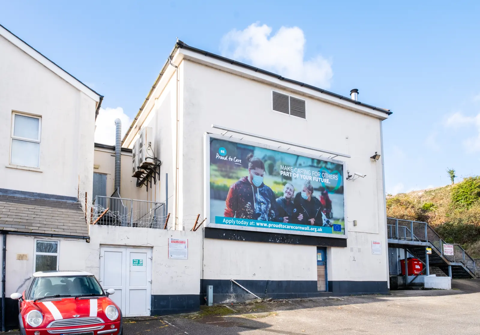 The whole building with the Alexandra Road billboard in St Austell